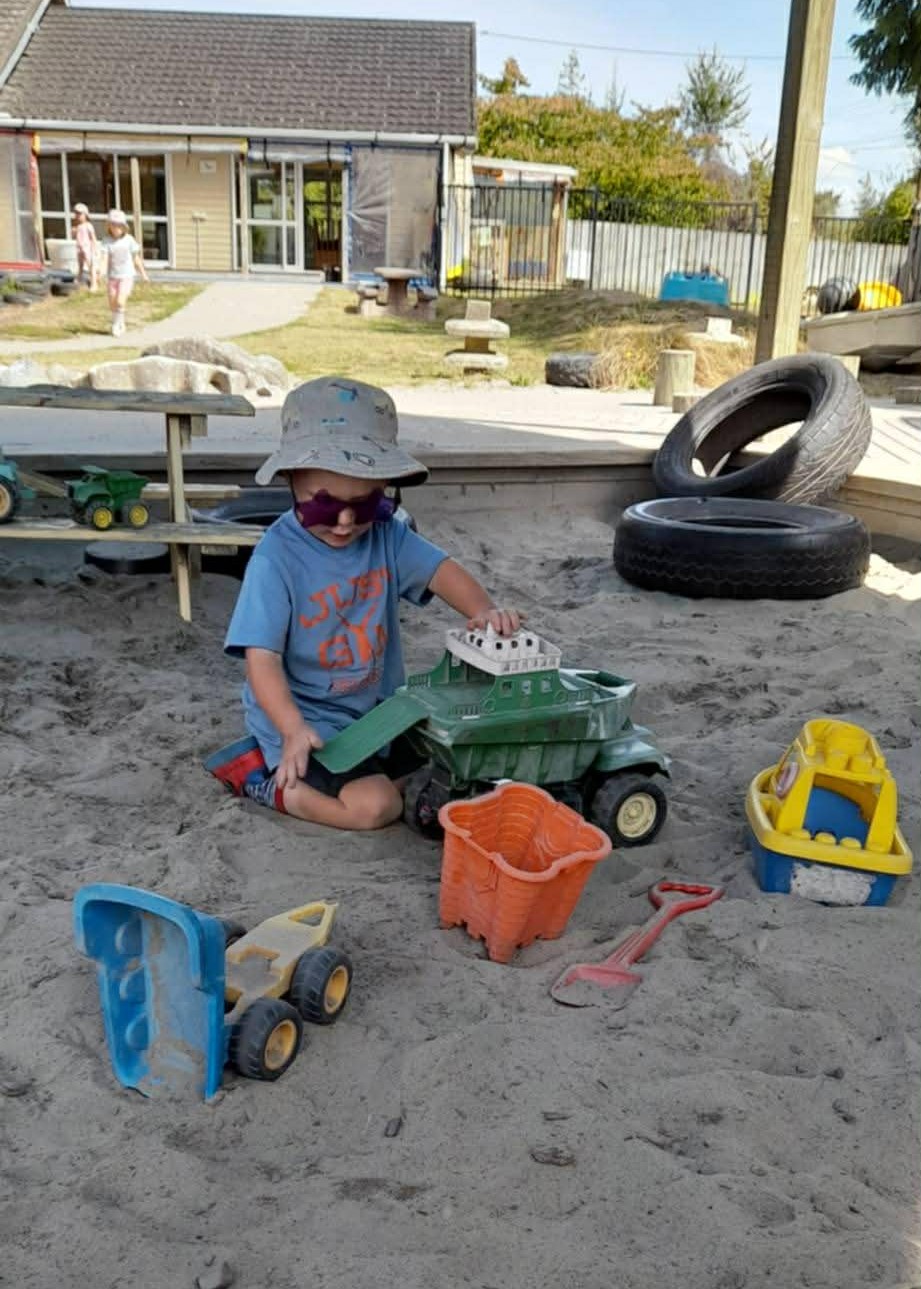 Children playing together and exploring at Junior Explorers